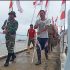HUT RI Ke-77, Dansatgas TMMD ke-114 Kibarkan Bendera Merah Putih di Pulau Parit